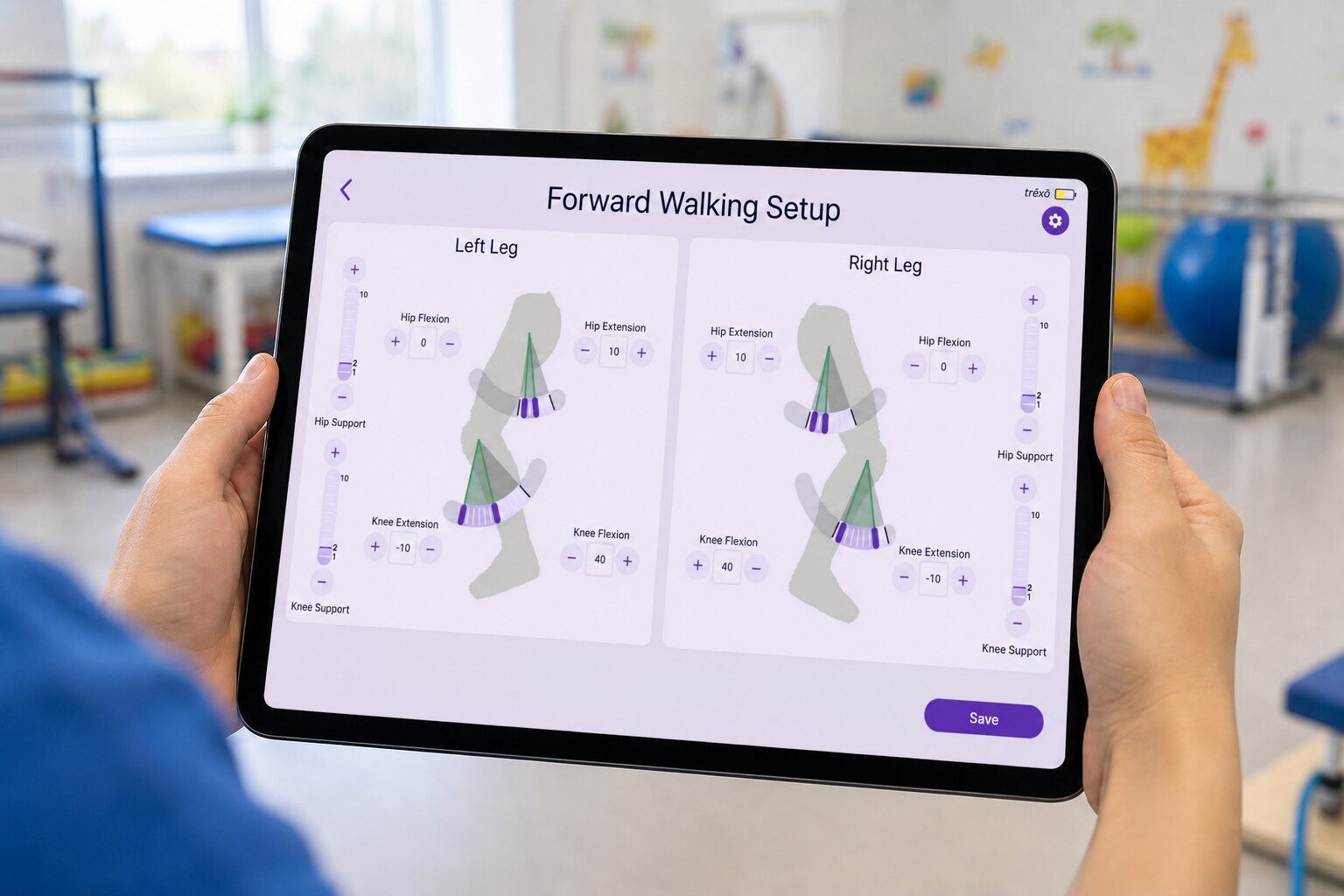 Clinician holding the Trexo tablet showing the Forward Walking Setup screen in a pediatric rehab clinic
